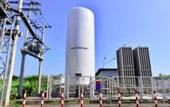 A white bulk liquid nitrogen tank with vaporizers
